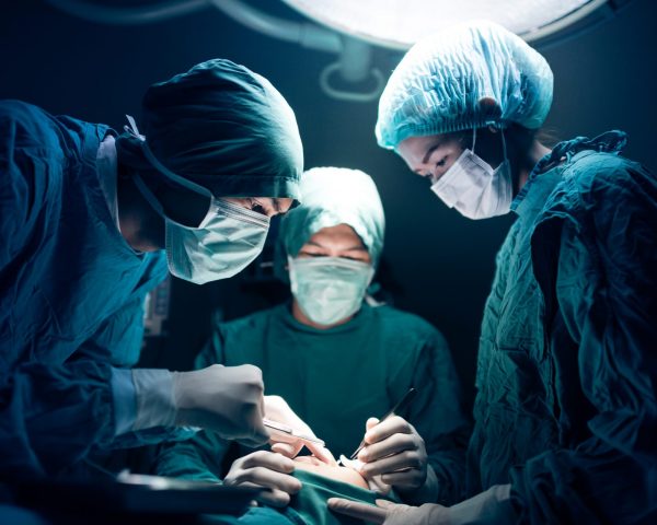 Surgical team working on a patient in operating theater