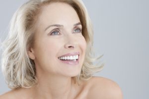 Portrait of smiling bare chested woman